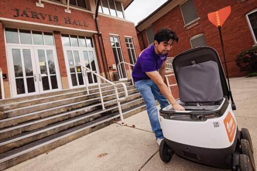 Starship food delivery robot on campus. (ECU Photo by Cliff Hollis)